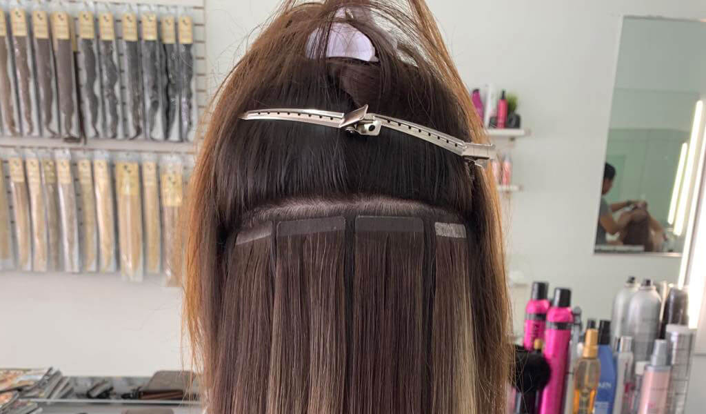 Tape in hair outlet extensions in short hair